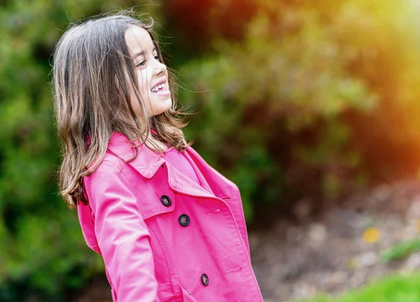 Summer portrait of happy cute child standing in a park — Stock Photo, Image