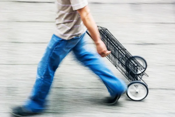 Blurry to view of man walking in a street — Stock Photo, Image