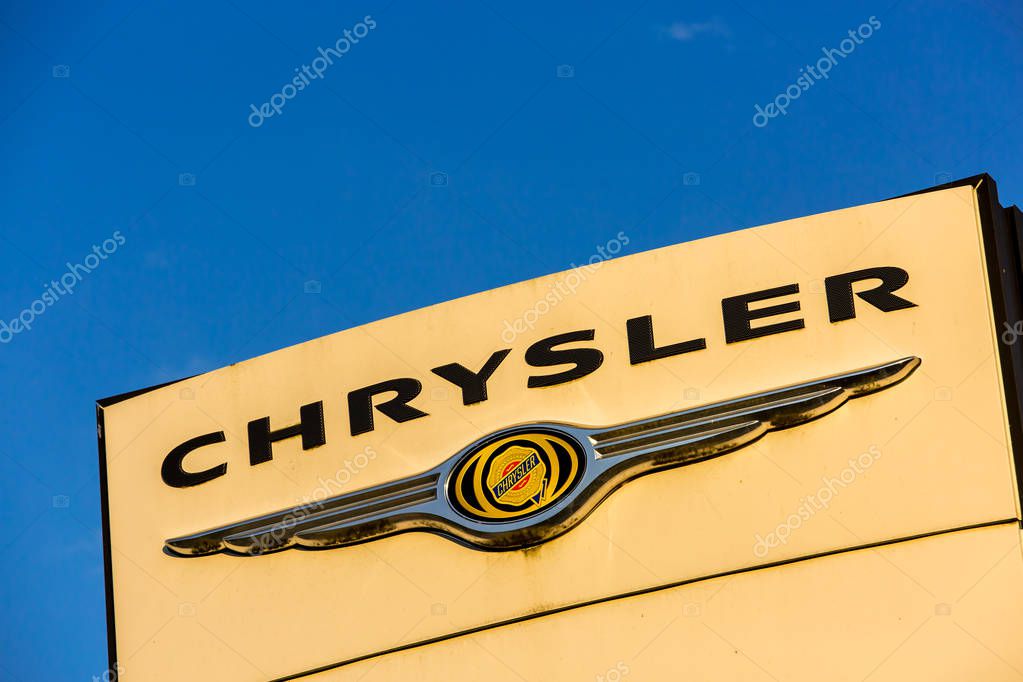 La rochelle, France - August 30, 2016: Official dealership sign of Chrysler against the blue sky. Chrysler is the American subsidiary of Fiat Chrysler Automobiles N.V., an Italian controlled automobile manufacturer registered in the Netherlands with