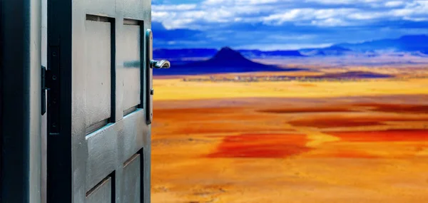 Opened door concept to colorful desert landscape — Stock Photo, Image