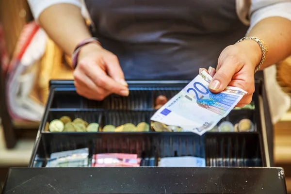 stock image woman is paying In cash with euro banknotes