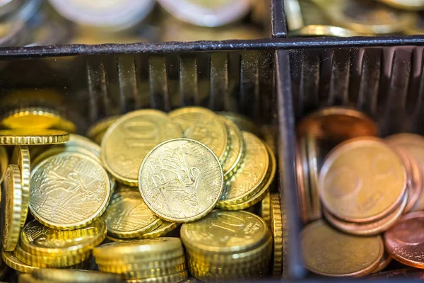 Open cash registrer containing many coins of euro ans banknotes — Stock Photo, Image