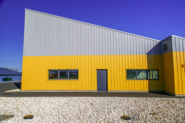 Surgeres, France - April 09, 2017:newly build modern red office building with warehouse