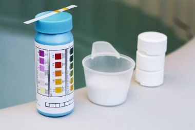 tester with tablet and powder of chlorine or bromide for maintea clipart