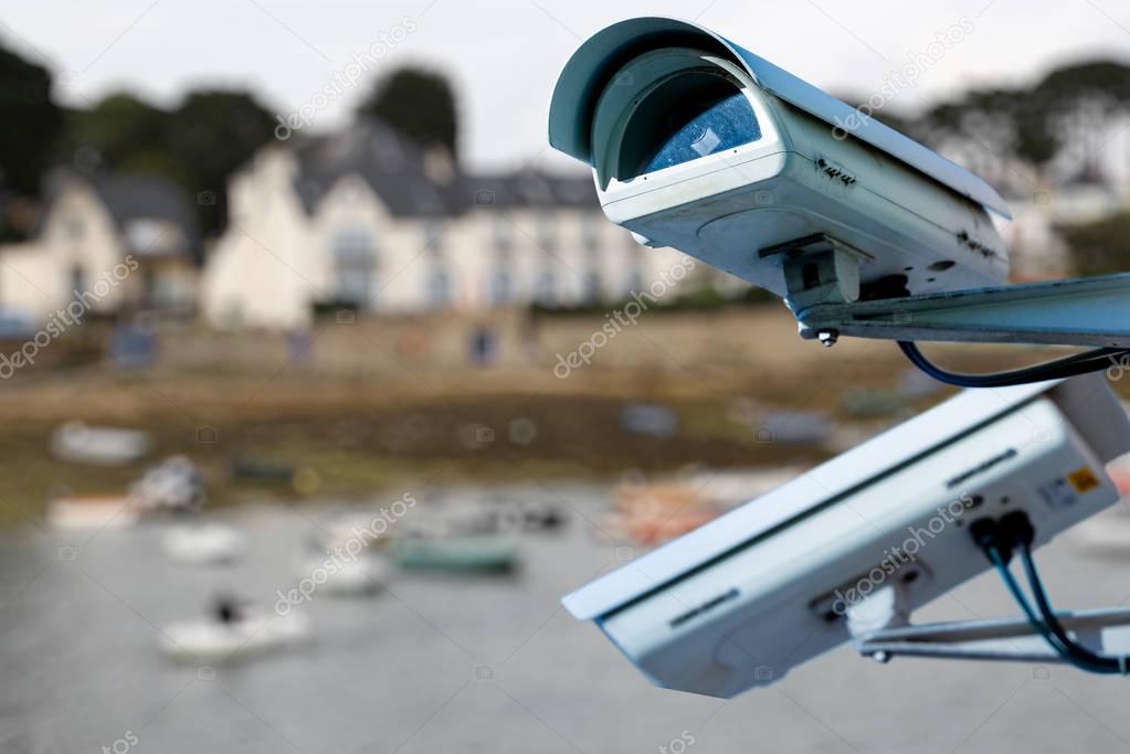 security CCTV camera or surveillance system with Marina on blurry background