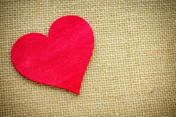 Heart isolated on a burlap fabric. Valentines Day and love concept Royalty Free Stock Images