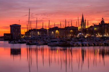 La Rochelle - Harbor by night with beautiful sunset clipart