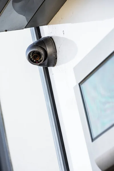 Close up on a white cctv on a wall near ATM — Stock Photo, Image