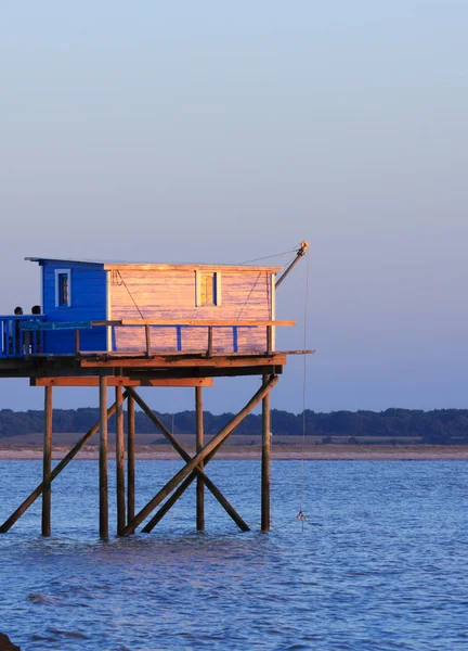 Beautiful view of fishing huts at sunset over the Atlantic Ocean — Stock Photo, Image