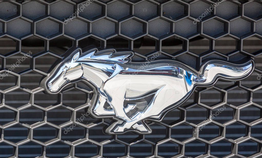 Puilboreau, France - August 7, 2016 : Ford Mustang Logo on car front grille at showroom in Puilboreau, France. The Ford Mustang is an American car manufactured by Ford.