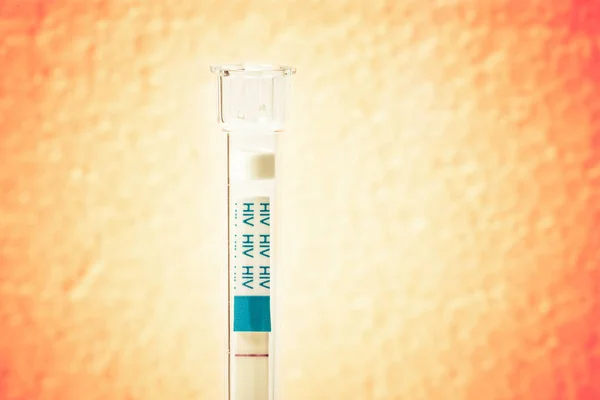 HIV self-test with blood effect on background — Stock Photo, Image