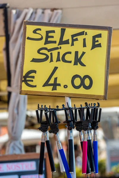 Selfie sticks sale boards on street — Stock Photo, Image