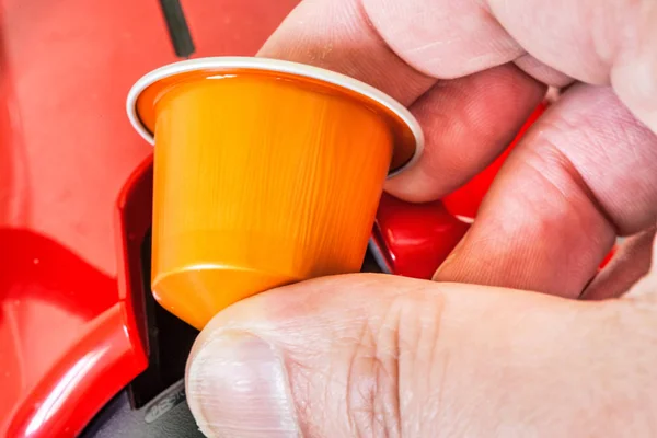 Colorful espresso coffee doses in hand — Stock Photo, Image