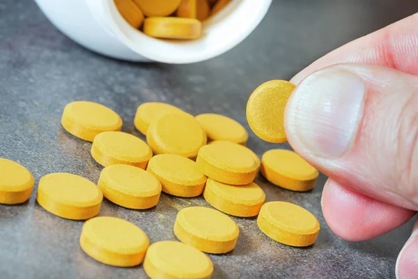 Turmeric tablets, a natural food supplement with multiple virtue — Stock Photo, Image