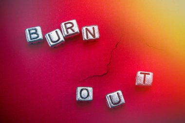 Burnout background concept with cubic metal letters
