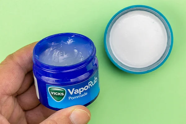 Closeup on bottle of vicks vaporub held in the hand — Stock Photo, Image