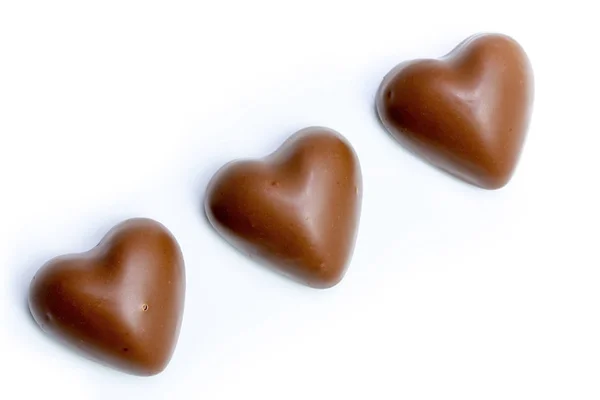 Chocolate marshmallow em forma de coração no fundo branco — Fotografia de Stock