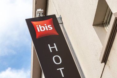 Cognac, France - February 16, 2020: Ibis hotel sign on a pole. Ibis is an international hotel company, owned by a holding company of hotels AccorHotels