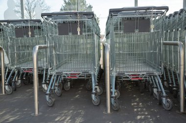 Cognac, France - February 21, 2020:Lidl Supermarket shopping trolleys aligned and stored in an empty supermarket with no customers
