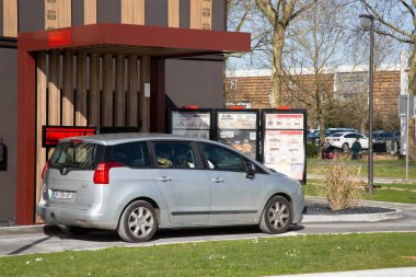 Cognac, France - February 21, 2020:View of the order taking area located on the drive of the Burger King cognac restaurant. Customers parked in cars place orders over the voice terminal