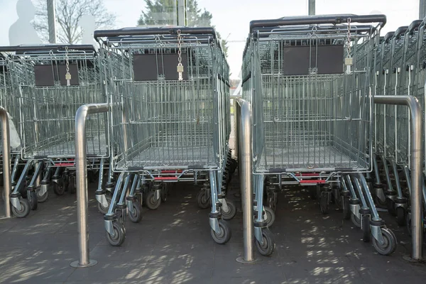 Cognac, France - February 21, 2020:Lidl Supermarket shopping trolleys aligned and stored in an empty supermarket with no customers