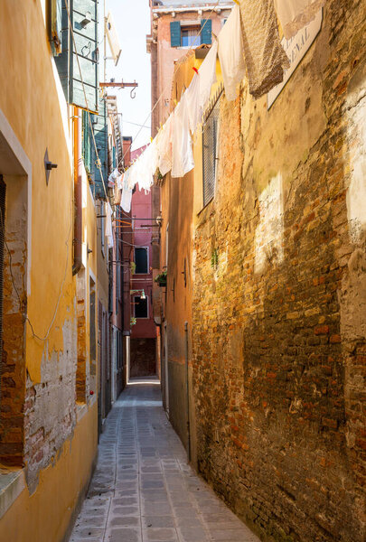 Deserted alley in the old district of Venice, Italy