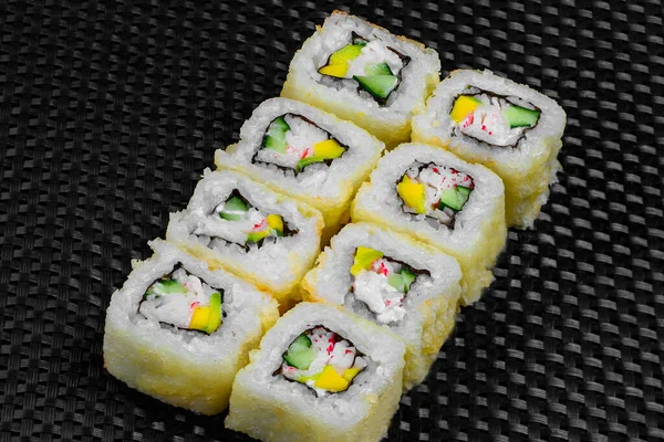 Japanese rolls on a dark textured background — Stock fotografie