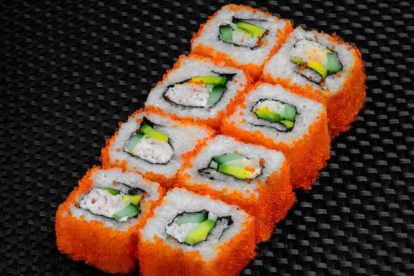 Japanese rolls on a dark textured background — Stock fotografie