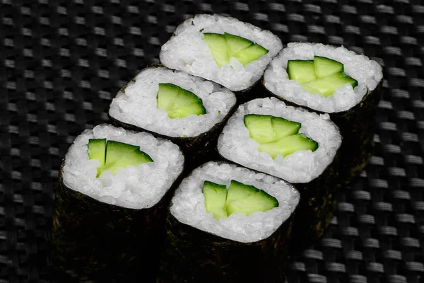 Japanese rolls on a dark textured background — Stock fotografie