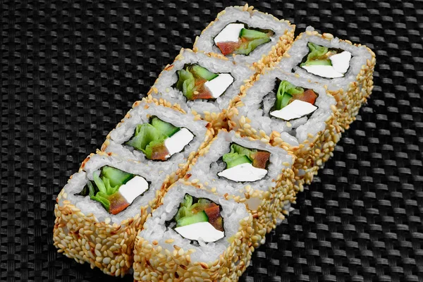 Japanese rolls on a dark textured background — Stock fotografie