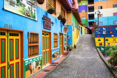 GUATAPE, COLOMBIA - OCTOBER 11, 2016: Colorful streets and decor clipart