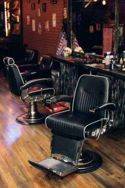 modern empty barbershop interior with chairs, mirrors and lamps. clipart