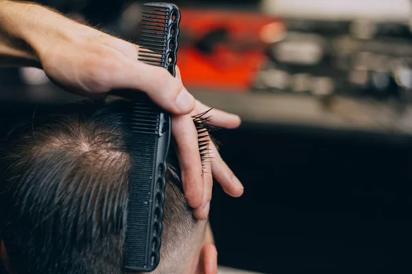 straight razor, brush for shaving beard along with bowl, blurred background of hair salon for men, barber shop.