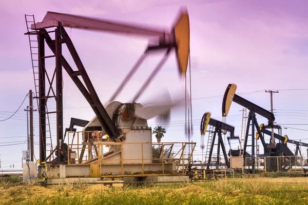 Crude oil pumps natural resources from the ground in California USA