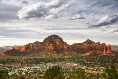 Capitol Butte and Coffee Pot Rock formation as seen from Airport Mesa over the town of Sedona Arizona USA clipart