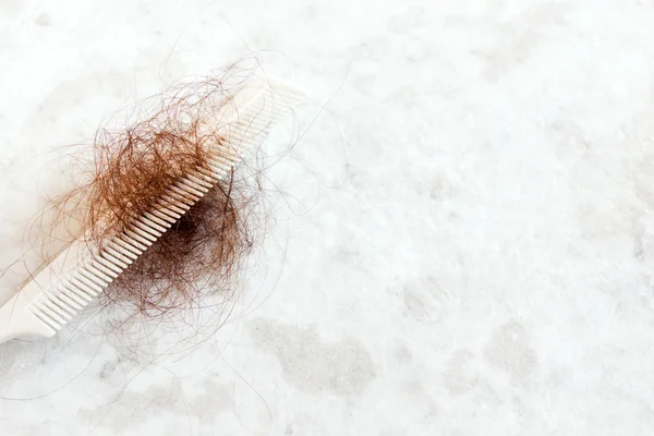 Hair on white comb — Stock Photo, Image