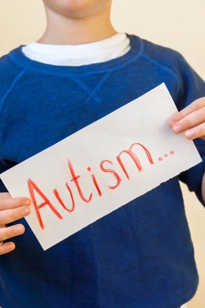 Autism-text i barn händer — Stockfoto