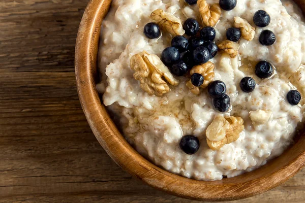 Oatmeal Porridge Walnuts Blueberries Honey Wooden Bowl Copy Space Healthy — Stock Photo, Image