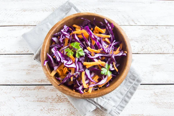 Red Cabbage Coleslaw Salad with Carrots and Greens - healthy diet, detox, vegan, vegetarian, vegetable spring salad, copy space for text