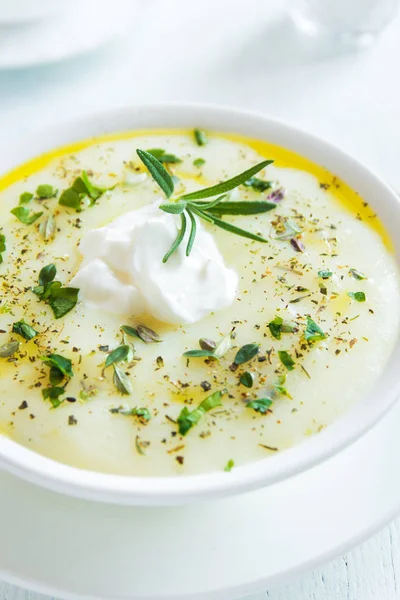 Homemade cauliflower and potato soup with cream cheese, rosemary, herbs and spices  - fresh organic vegetable vegetarian vegan spicy diet cream soup meal food