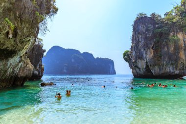 Krabi, Thailand - March 17, 2019: Beach with crystal emerald green sea at Lao Lading Island in Andaman sea.