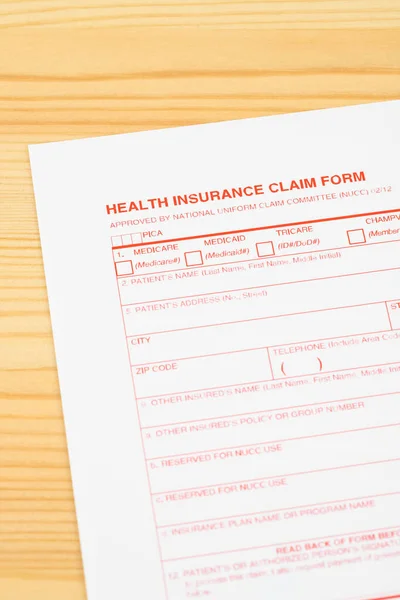 Health Insurance Claim Form Wooden Desk — ストック写真