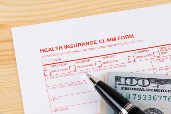 Health Insurance Claim Form Pen Wooden Desk — Stock Photo, Image