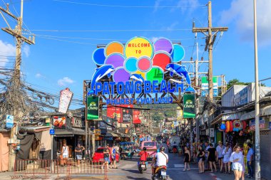 Phuket, Thailand - February 13, 2020: Patong walking street or Bangla Road, famous shopping and entertainment destination close to the beach during night time. clipart