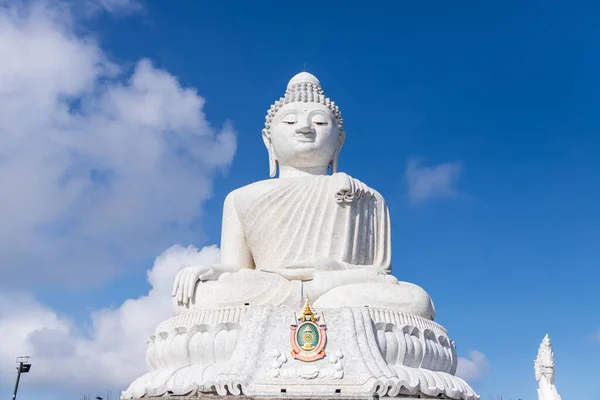 Phuket, Thailand - Febryary 14, 2020: Big marble Buddha statue on top of Nagakerd Mountain. Famous destination for pilgrim and tourist.