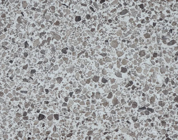 White granite with black splashes of the small fraction.