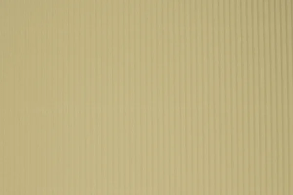 Corrugated yeiiow color paper background texture, copy space, template. Colorful background, corrugated paper cardboard, copy space, template.