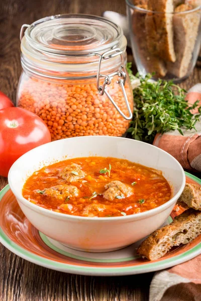 Hot aromatic rich tomato soup with meatballs, vegetables, red le — Stock Photo, Image
