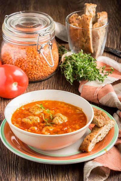 Hot aromatic rich tomato soup with meatballs, vegetables, red le — Stock Photo, Image