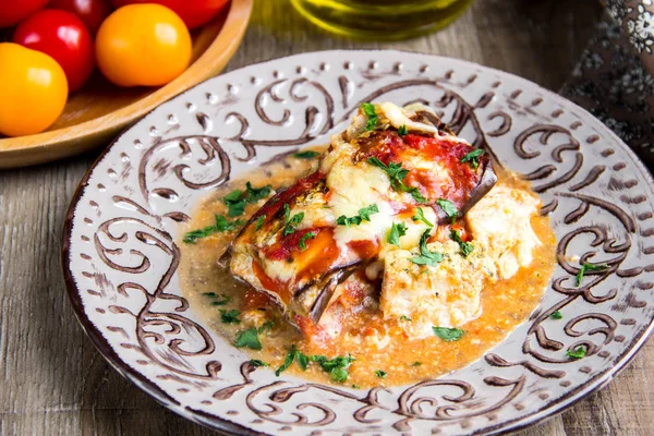 Parmigiano with tomatoes, eggplant, cheese, meat, chicken, tradi — Stock Photo, Image